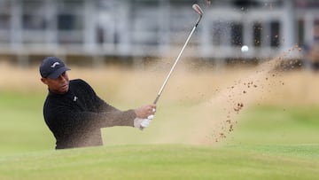 Woods of the USA playing out of a bunker on the 16th hole during a practice round for the Open Golf Championships 2024